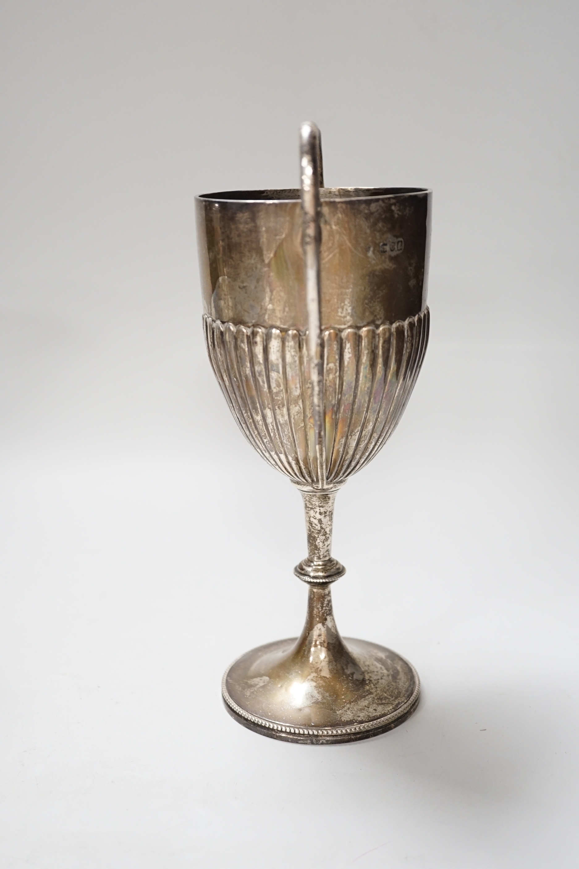 An Edwardian two handled silver trophy cup with demi fluted body, London 1901, 25.5cm, 358 grams